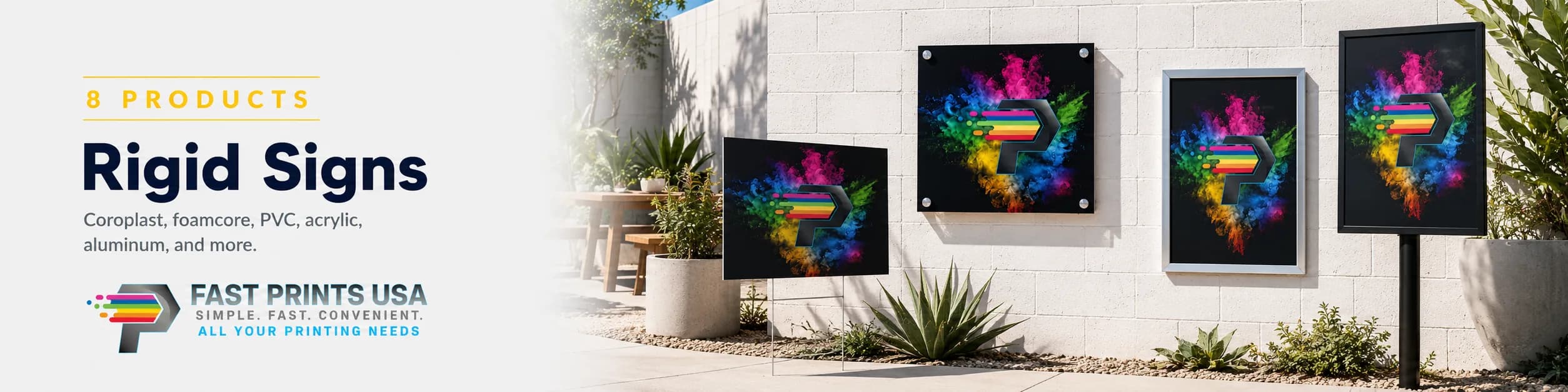 Rigid signs — yard signs, an acrylic panel, and framed and post-mounted signs — printed with a rainbow Fast Prints USA logo and displayed against an outdoor stone wall.